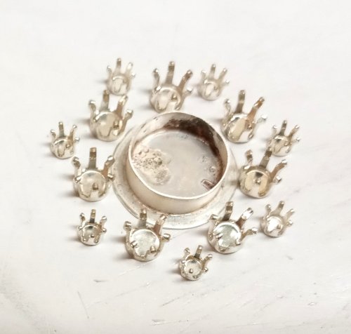 Judy Larson's CZ Explosion Necklace - , Holiday Designs, Cutting, Cutting Tool, Cutters, Filing, Finishing, How To Punch Holes, Hole Punching, Punch A Hole, Tumbling, Tumble, Tumbling Jewelry, Butane Torch, Soldering, Solder, Design, Drilling, Drill, Solder the bezel to a prepared 22 gauge